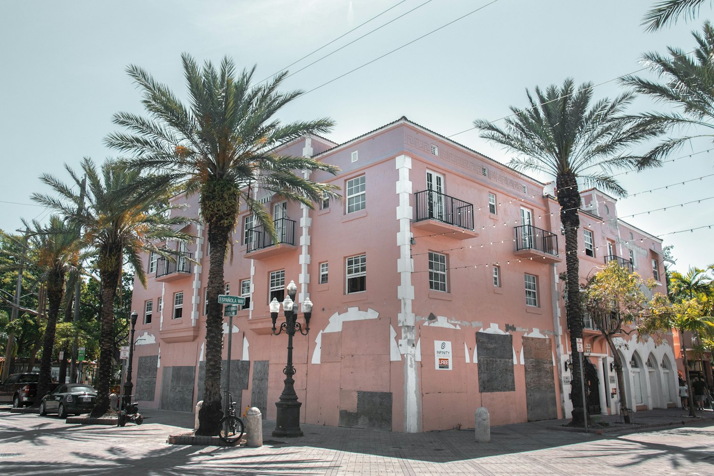 Pink building under palms