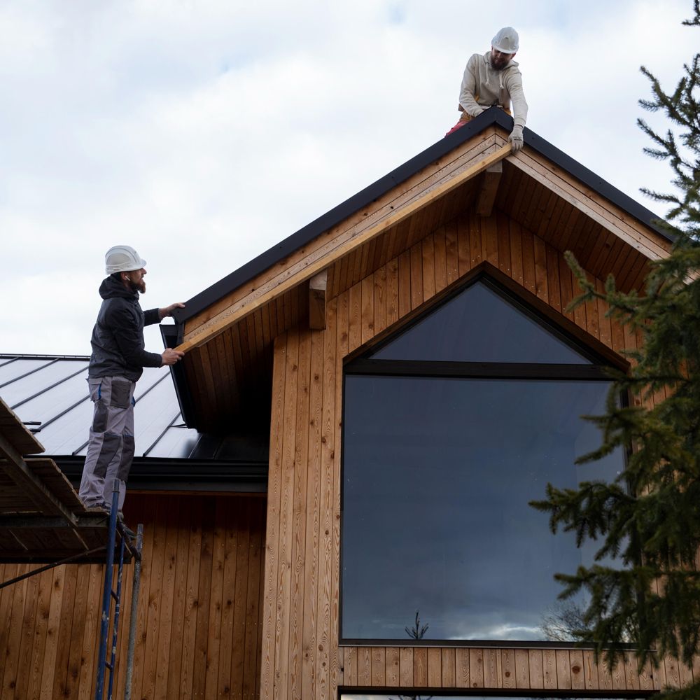 Roofers on a house